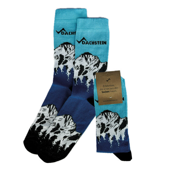 Three pairs of socks with Dachstein lettering and mountain motif in blue, white and black, one with label | © Planai-Hochwurzen-Bahnen Gesellschaft m.b.H.