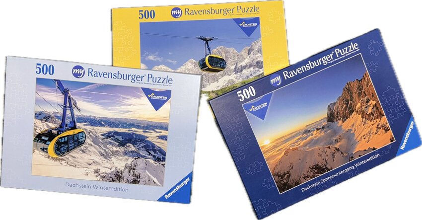 Three 500-piece Ravensburger puzzle boxes with Dachstein cable car and mountain landscape motifs | © Planai-Hochwurzen-Bahnen Gesellschaft m.b.H.