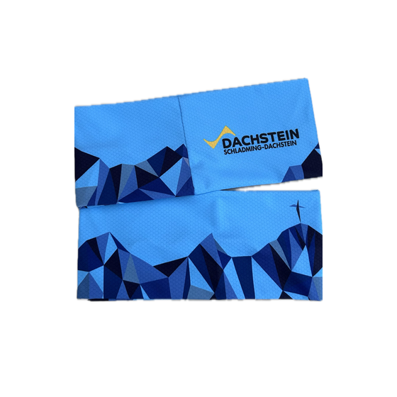 Folded blue brochure with Dachstein logo and geometric mountain design on a light background.