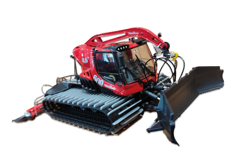 Red PistenBully model snow groomer with tracks and front blade, isolated on a light background. | © Bergbahnen Filzmoos GmbH