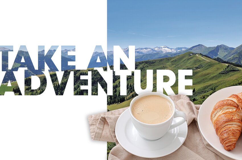 Cup of coffee with two croissants in front of green alpine view and “Take an Adventure” text | © Großarler Bergbahnen GmbH & Co KG